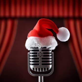 Christmas,Entertainment,Performance,With,Retro,Microphone,Wearing,Santa,Hat,On